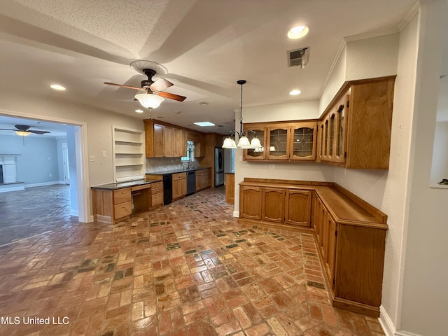 kitchen featuring brown cabinetry, baseboards, a ceiling fan, and visible vents