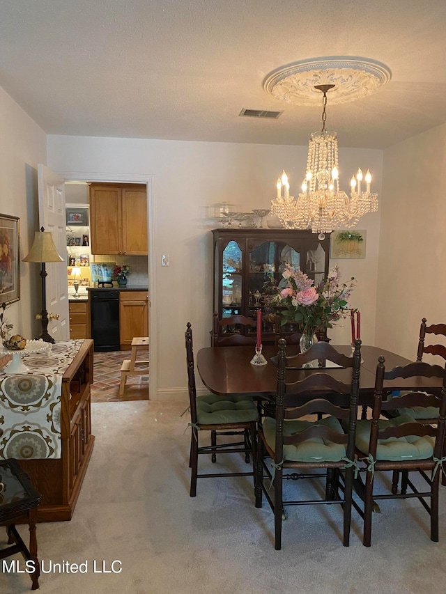 carpeted dining area featuring a notable chandelier