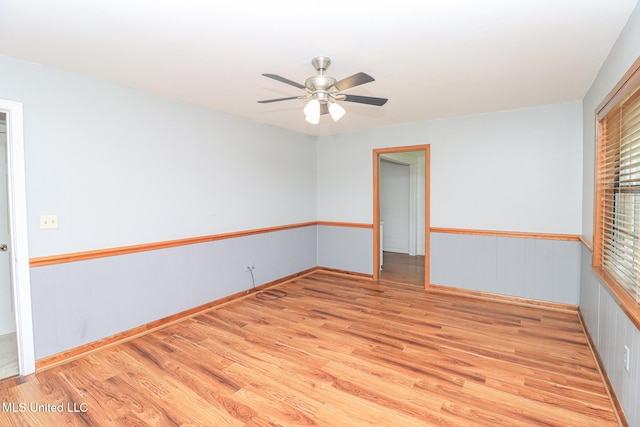 206 Oak Park Dr, Pearl, MS 39208 - empty room featuring wood finished floors, a ceiling fan, and plenty of natural light
