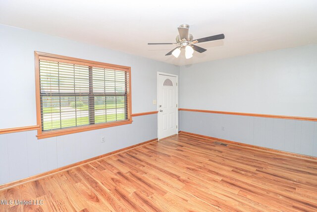 206 Oak Park Dr, Pearl, MS 39208 - empty room with wood finished floors and a ceiling fan