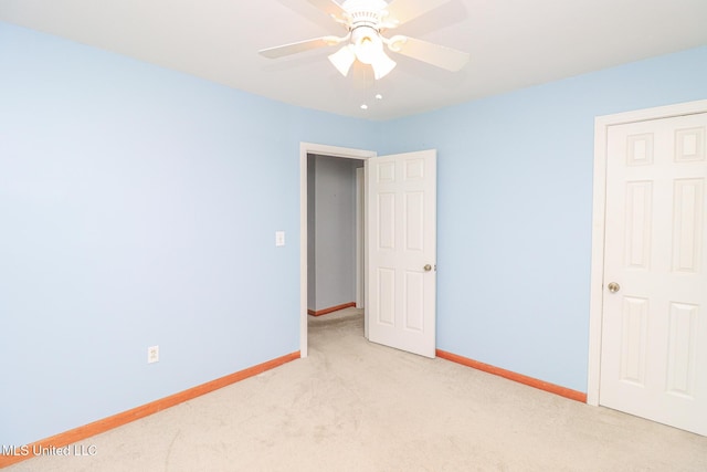 206 Oak Park Dr, Pearl, MS 39208 - unfurnished bedroom featuring light carpet and ceiling fan