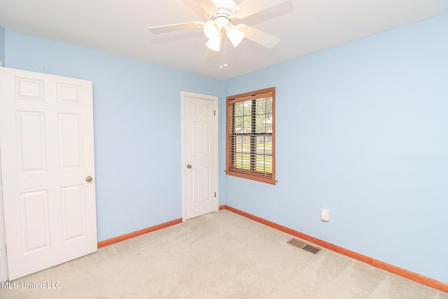 206 Oak Park Dr, Pearl, MS 39208 - unfurnished bedroom with light carpet and a ceiling fan