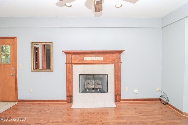 206 Oak Park Dr, Pearl, MS 39208 - unfurnished living room with a tile fireplace, light wood-style flooring, a ceiling fan, and recessed lighting