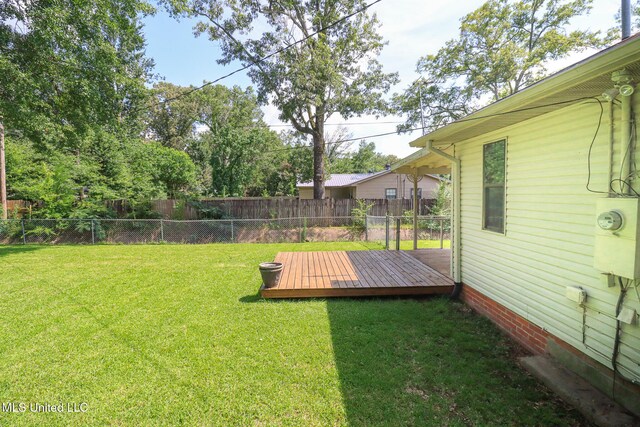 206 Oak Park Dr, Pearl, MS 39208 - fenced backyard with a wooden deck