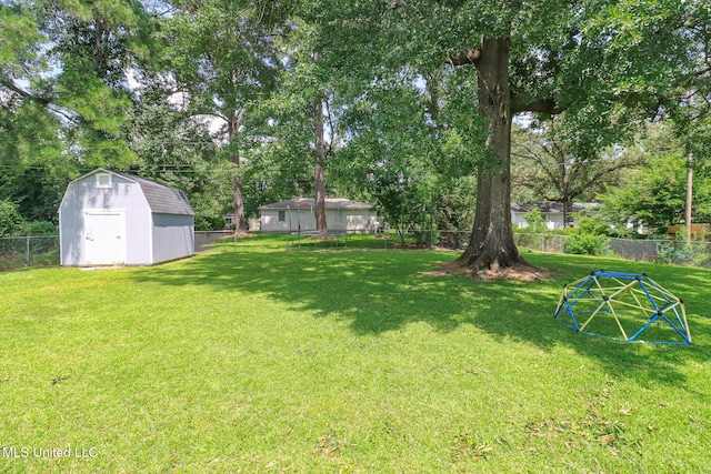 206 Oak Park Dr, Pearl, MS 39208 - fenced backyard featuring a shed and view of wooded area