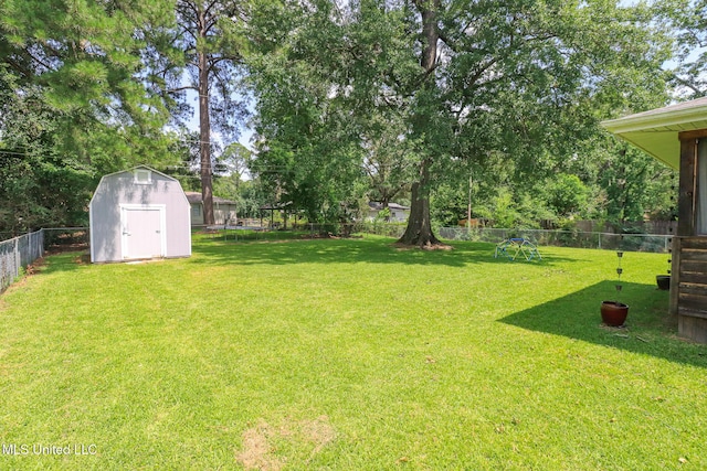 206 Oak Park Dr, Pearl, MS 39208 - fenced backyard featuring a storage unit and view of scattered trees