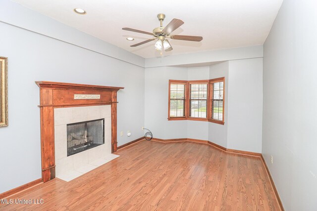 206 Oak Park Dr, Pearl, MS 39208 - unfurnished living room featuring wood finished floors, a ceiling fan, a fireplace, and recessed lighting