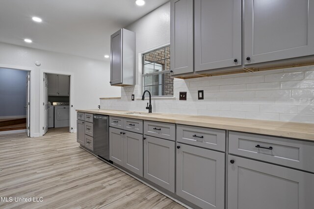 8839 Moanalua Way, Diamondhead, MS 39525 - kitchen with gray cabinetry, butcher block counters, separate washer and dryer, and recessed lighting