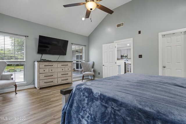 8839 Moanalua Way, Diamondhead, MS 39525 - bedroom featuring high vaulted ceiling, light wood finished floors, and ceiling fan
