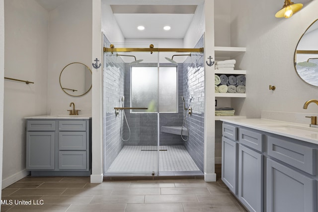 8839 Moanalua Way, Diamondhead, MS 39525 - full bathroom with two vanities, a shower stall, and recessed lighting