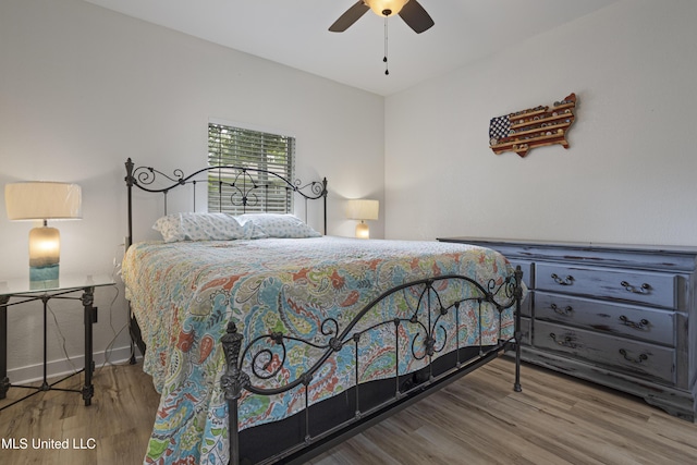 8839 Moanalua Way, Diamondhead, MS 39525 - bedroom featuring wood finished floors and a ceiling fan