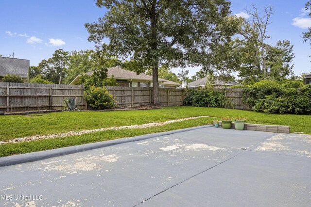 8839 Moanalua Way, Diamondhead, MS 39525 - fenced backyard featuring a patio