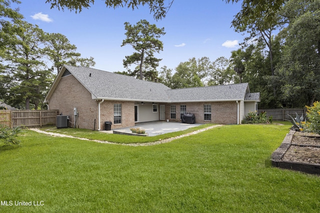 8839 Moanalua Way, Diamondhead, MS 39525 - rear view of house featuring brick siding, a patio, and a fenced backyard