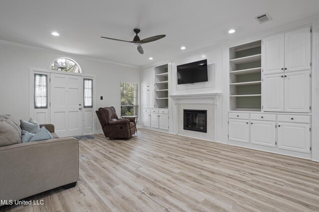 8839 Moanalua Way, Diamondhead, MS 39525 - living area featuring ceiling fan, ornamental molding, light wood-style floors, recessed lighting, and a glass covered fireplace