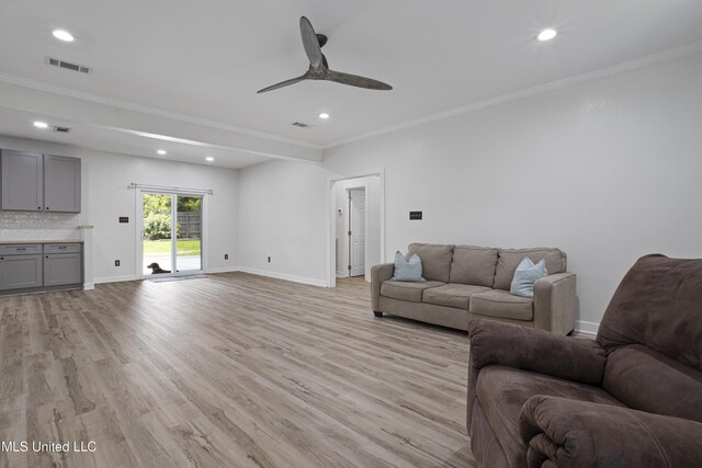 8839 Moanalua Way, Diamondhead, MS 39525 - living room with ornamental molding, light wood-style floors, recessed lighting, and a ceiling fan
