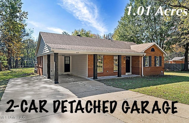 ranch-style house featuring a carport and a front yard