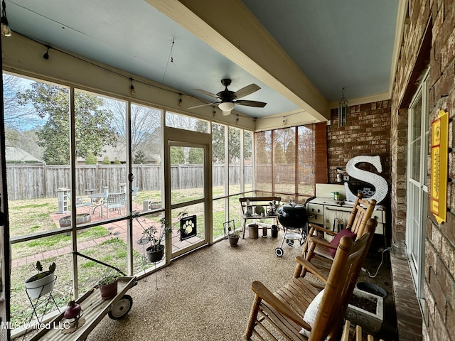 sunroom / solarium with ceiling fan