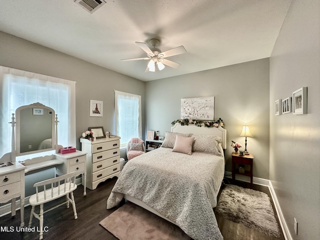 bedroom featuring ceiling fan and dark hardwood / wood-style floors