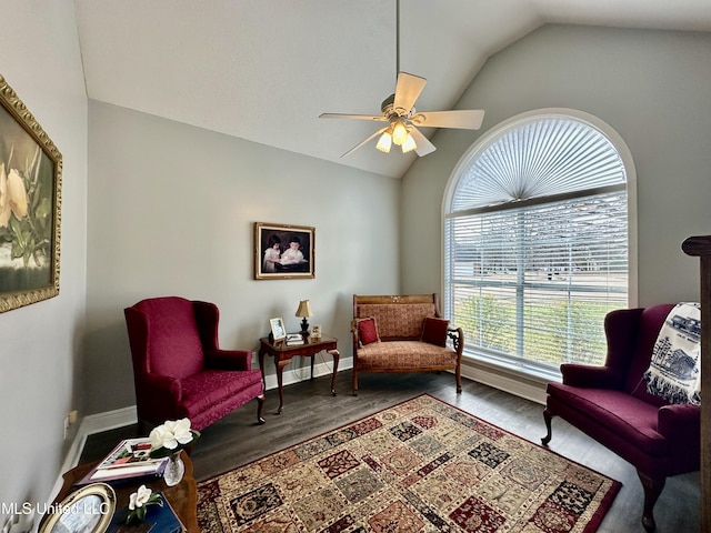 sitting room with lofted ceiling, hardwood / wood-style flooring, and ceiling fan