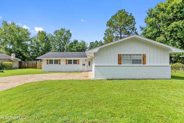 2607 Calle De Feliz St, Gautier, MS 39553 - view of front of home featuring driveway, brick siding, and board and batten siding