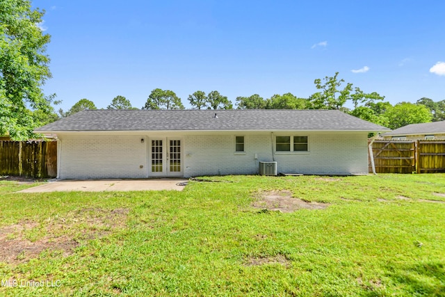 2607 Calle De Feliz St, Gautier, MS 39553 - back of property featuring french doors, a patio area, and brick siding