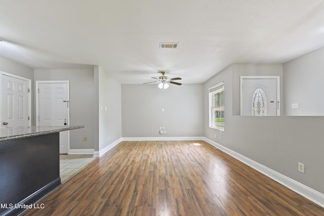 2607 Calle De Feliz St, Gautier, MS 39553 - unfurnished living room featuring wood finished floors and a ceiling fan
