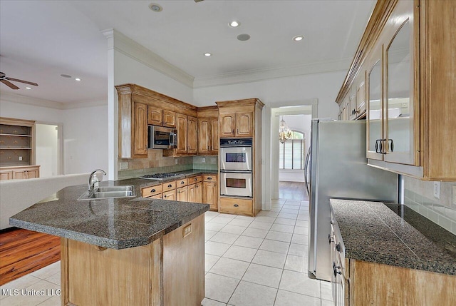 kitchen with sink, crown molding, stainless steel appliances, light tile patterned flooring, and kitchen peninsula