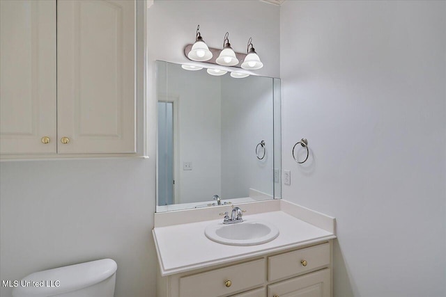 bathroom with vanity and toilet