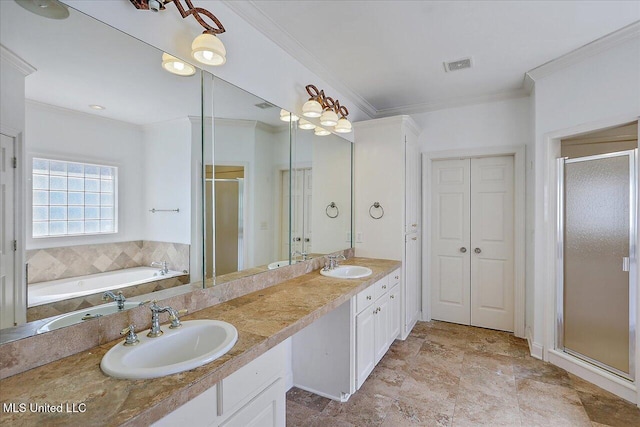 bathroom with vanity, ornamental molding, and separate shower and tub