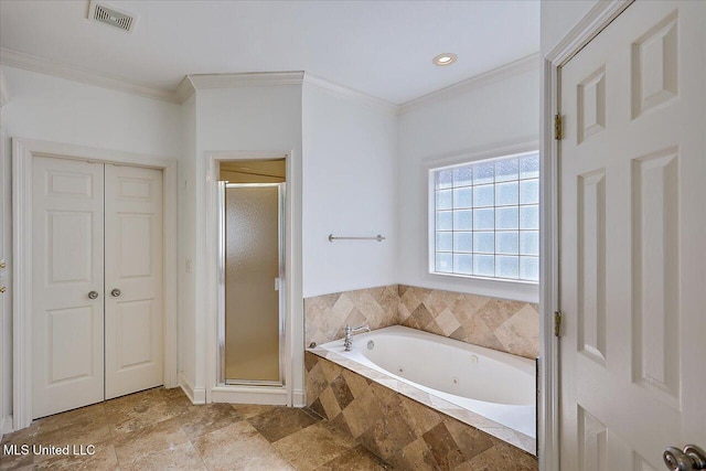 bathroom featuring ornamental molding and independent shower and bath