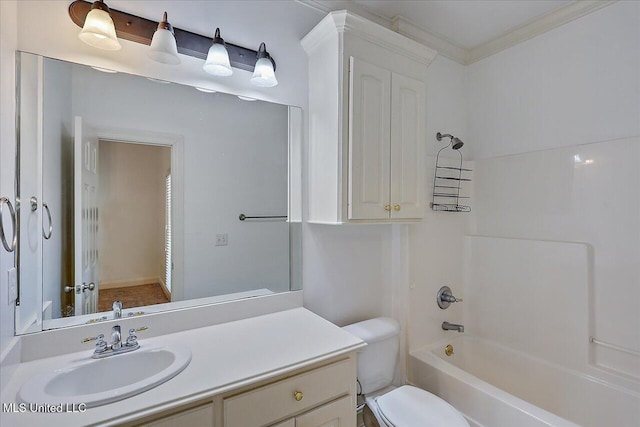 full bathroom featuring bathing tub / shower combination, vanity, crown molding, and toilet