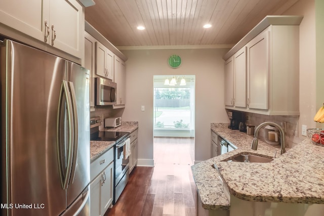 508 Dynsmore Pl, Long Beach, MS 39560 - kitchen featuring stainless steel appliances, wood ceiling, light stone countertops, dark wood finished floors, and decorative backsplash