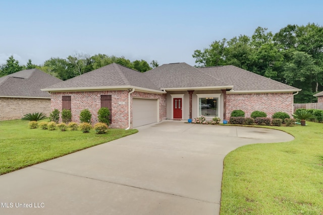508 Dynsmore Pl, Long Beach, MS 39560 - view of front of property with a garage, a shingled roof, brick siding, and driveway