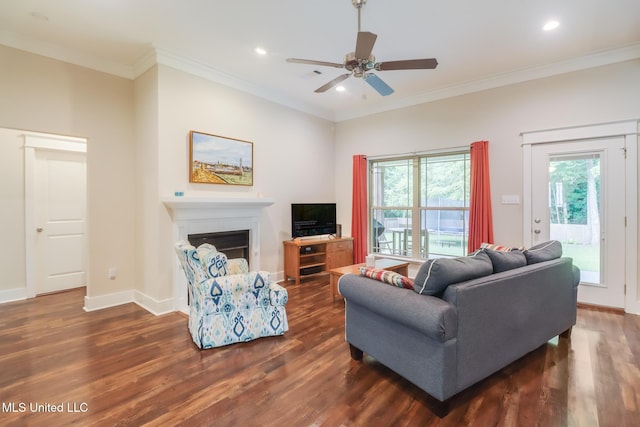 508 Dynsmore Pl, Long Beach, MS 39560 - living room with dark wood finished floors, a ceiling fan, a fireplace, recessed lighting, and crown molding