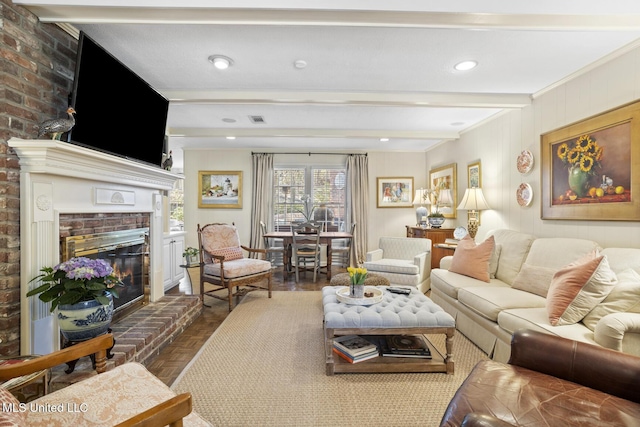 living area featuring recessed lighting, a fireplace, visible vents, ornamental molding, and beamed ceiling