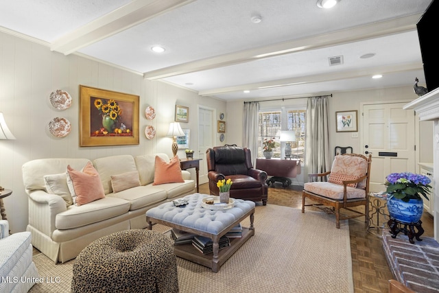 living area with recessed lighting, beam ceiling, and visible vents