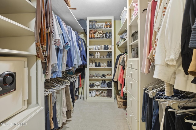 walk in closet featuring carpet