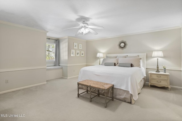 bedroom featuring carpet floors, ceiling fan, baseboards, and crown molding