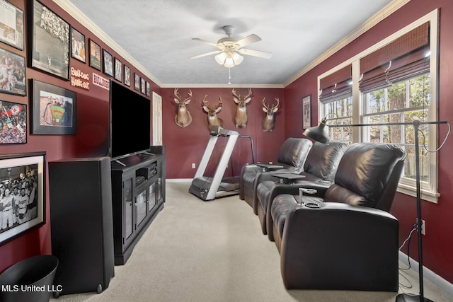 living area featuring a ceiling fan, carpet, crown molding, and baseboards