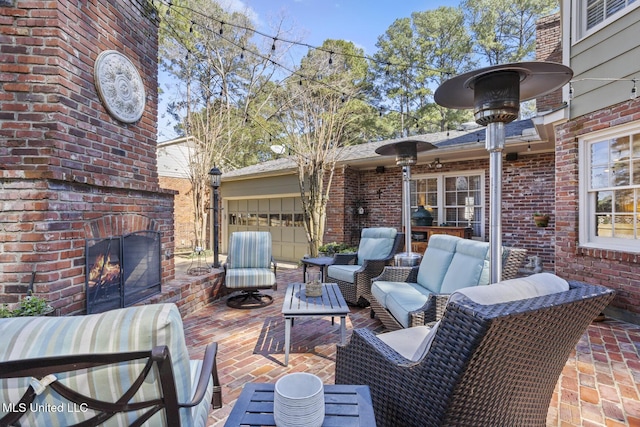 view of patio / terrace featuring an outdoor living space with a fireplace