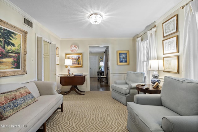 sitting room featuring ornamental molding and visible vents