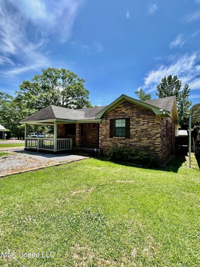 309 College St, Carthage, MS 39051 - ranch-style home featuring covered porch, brick siding, and a front yard