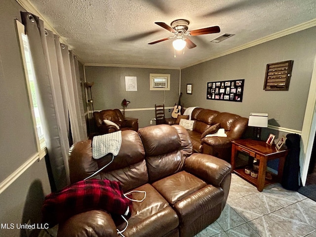 309 College St, Carthage, MS 39051 - tiled cinema with ornamental molding, a textured ceiling, visible vents, and ceiling fan