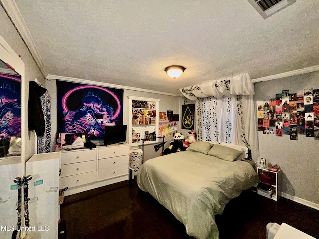 309 College St, Carthage, MS 39051 - bedroom with a textured ceiling, visible vents, and ornamental molding