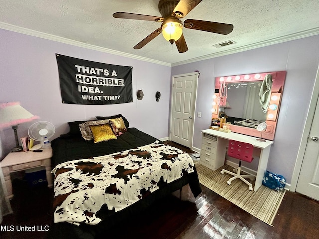 309 College St, Carthage, MS 39051 - bedroom with a textured ceiling, ceiling fan, visible vents, crown molding, and wood finished floors