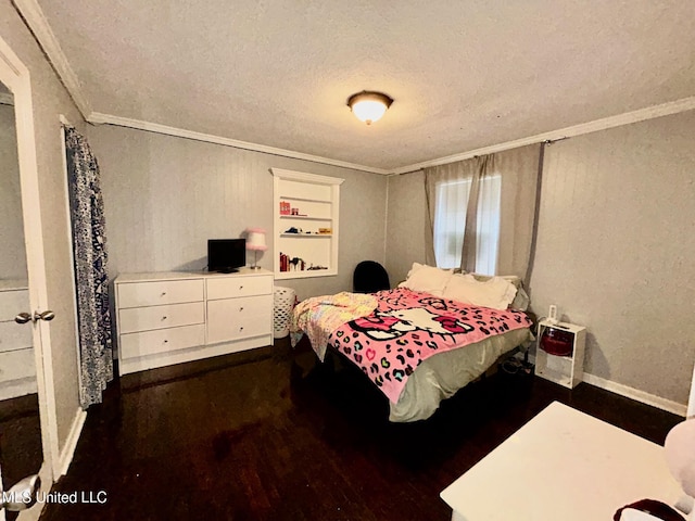 309 College St, Carthage, MS 39051 - bedroom featuring crown molding, a textured ceiling, wood finished floors, and baseboards