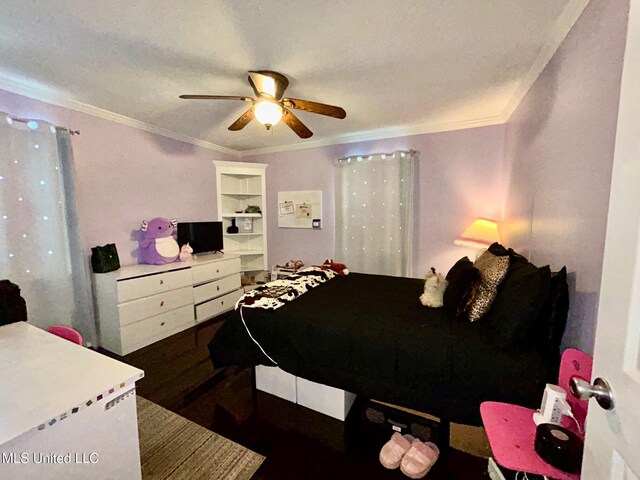 309 College St, Carthage, MS 39051 - bedroom with ornamental molding, wood finished floors, and a ceiling fan