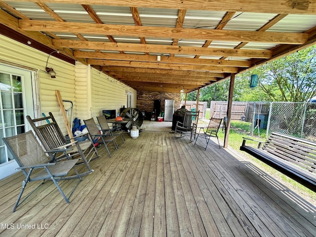 309 College St, Carthage, MS 39051 - deck with outdoor dining area and a fenced backyard
