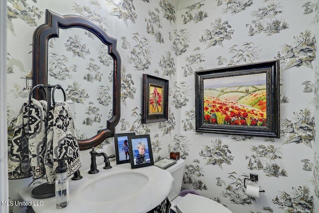 bathroom featuring sink and toilet