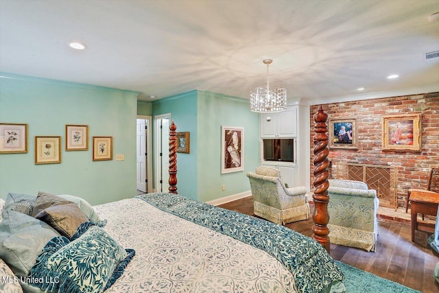 bedroom featuring a chandelier and dark hardwood / wood-style flooring